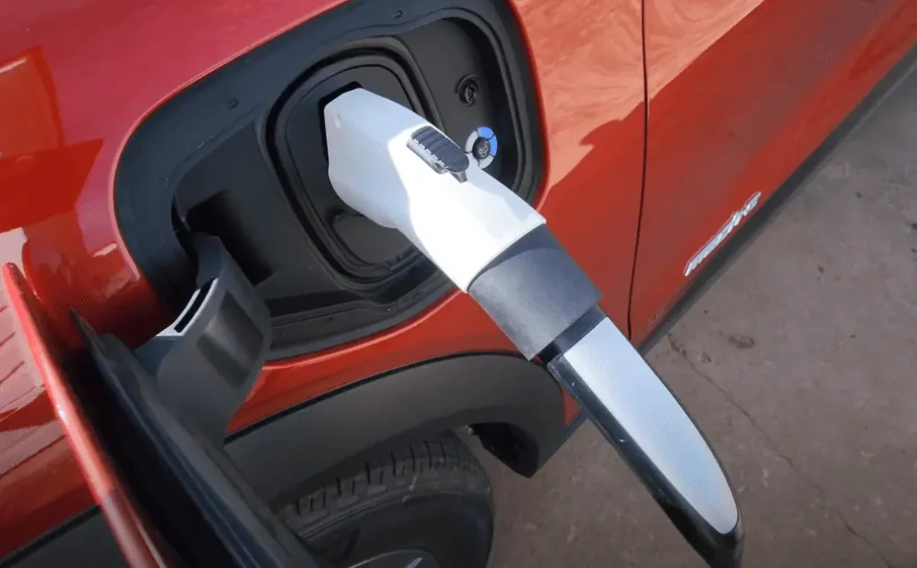 Image of an electric vehicle being charged using the Lectron Tesla to J1772 Adapter, demonstrating compatibility and versatility in EV charging solutions.
