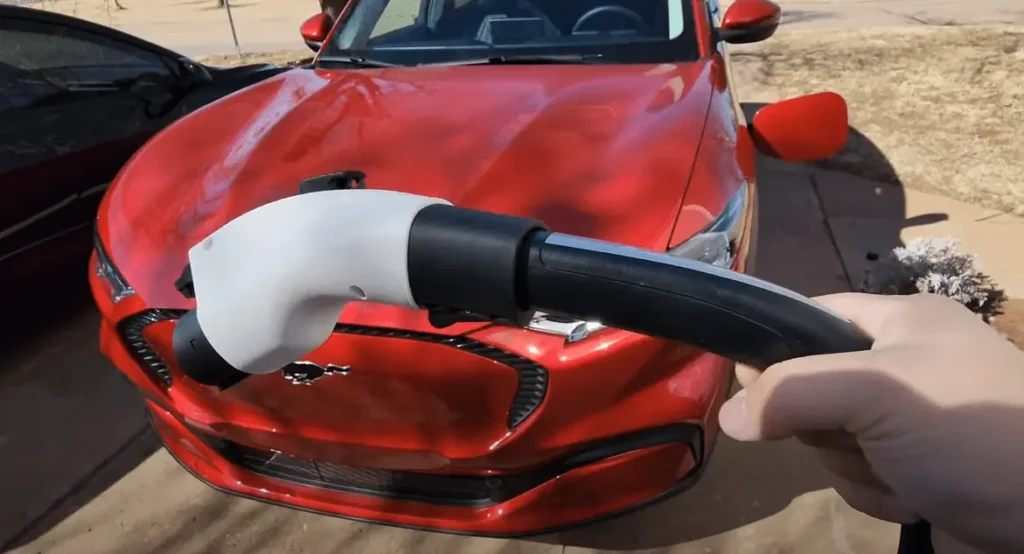 Lectron Tesla to J1772 Adapter connected to a Tesla Charger