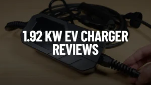White text "1.92 kW EV CHARGER REVIEWS" over a blurred background showing James holding a connector on a black 1.92 kW Megear Skysword II EV Charger with coiled cables on a wooden surface.