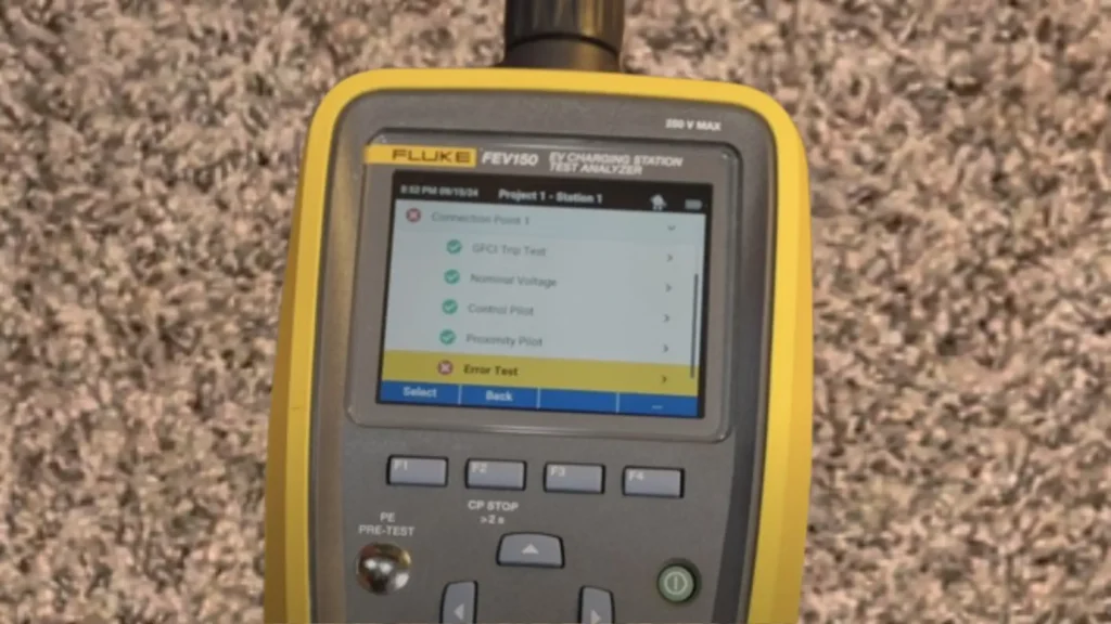 Close-up of a Fluke FEV150 EV Charging Station Test Analyzer's screen displaying test results; Connection Point 1, GFCI Trip Test, Nominal Voltage, Control Pilot, and Proximity Pilot