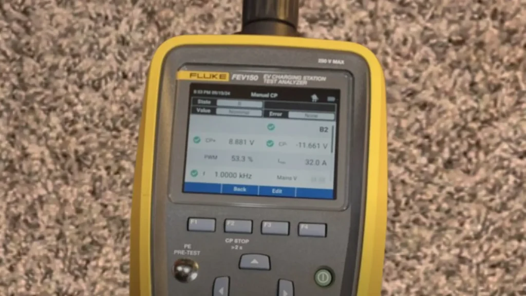 Close-up of our Fluke FEV150 EV Charging Station Test Analyzer's screen displaying real-time charging protocol (CP) voltage, pulse-width modulation (PWM) percentage, and measured amperage (AMP) during a 32A EV charger performance test, explaining the reason for the "32.0 A" reading.
