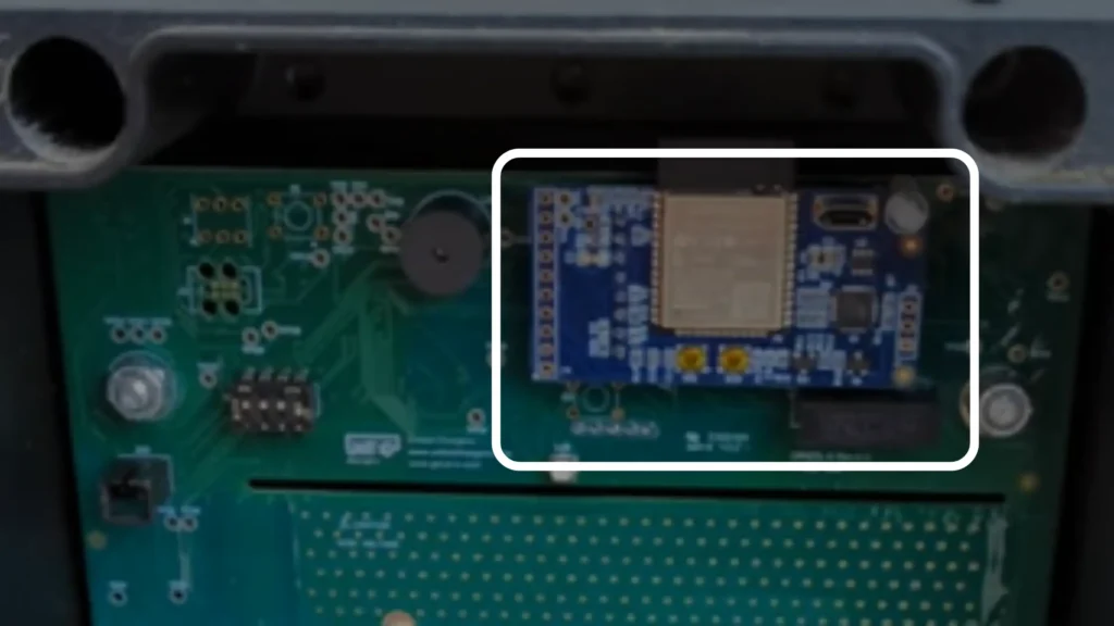 Internal view of a Grizzl-E Smart EV charger showing the main PCB and highlighted blue Wi-Fi communication module, which enables smart connectivity, remote monitoring, scheduling, and OTA updates