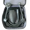 This image shows the Tesla Gen 3 Mobile Connector portable charging kit neatly organized inside its open, gray zippered storage bag. The kit is displayed on a clean white background, clearly presenting the components included with Tesla’s latest-generation portable EV charging solution. A long, heavy-duty black charging cable is carefully coiled around the inner perimeter of the bag. The thick insulation and flexible design highlight the cable’s durability and its intended use for both Level 1 and Level 2 portable charging. Positioned toward the center-left of the bag is the compact matte-black controller unit, commonly referred to as the charging “brick.” This housing contains the core EVSE electronics that regulate power delivery, communicate with the vehicle, and monitor safety conditions during charging. On the center-right side sits the ergonomic vehicle connector handle featuring Tesla’s North American Charging Standard (NACS) plug. The handle’s streamlined shape and integrated control button are designed for easy one-handed connection and removal from compatible Tesla charge ports. At the top of the kit are two interchangeable plug adapters used to connect the Gen 3 Mobile Connector to different power sources. On the top left is the NEMA 14-50 adapter, a 240-volt plug commonly used for RV outlets and high-power residential circuits. On the top right is the NEMA 5-15 adapter, the standard 120-volt household plug used for Level 1 charging. The entire Tesla Gen 3 Mobile Connector kit is designed as a portable charging solution that can be stored in a vehicle’s trunk, giving Tesla owners the flexibility to charge from a variety of outlets while traveling or away from home.